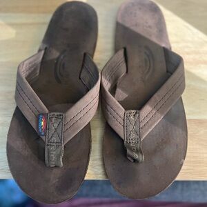 Rainbow flip-flops size 7.